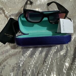 Sunglasses in Purple case.